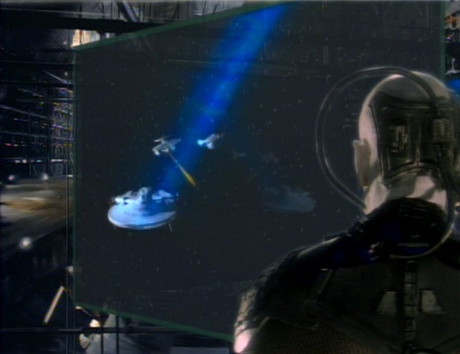 Locutus of Borg watching a few Federation starships firing on his Borg cube, including the USS Saratoga.