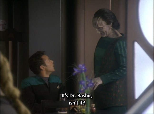 Dr. Bashir and Garak at a table on the Promenade. "It's Dr. Bashir, isn't it?"