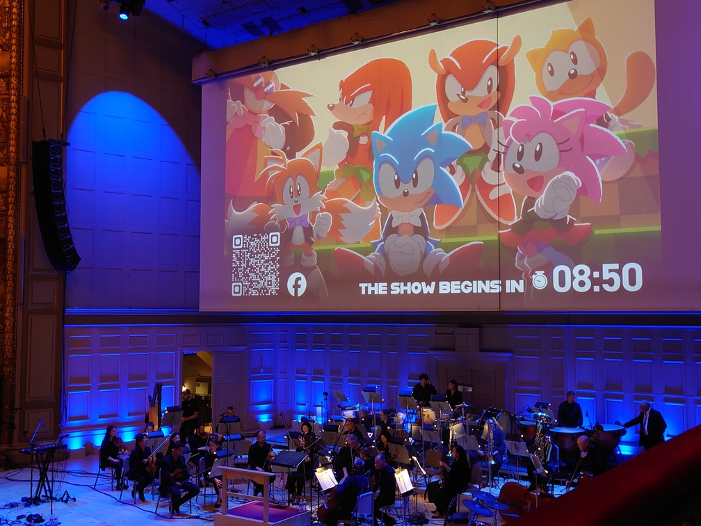 The orchestra preparing before the show started. The screen above is showing the time until the concert begins.